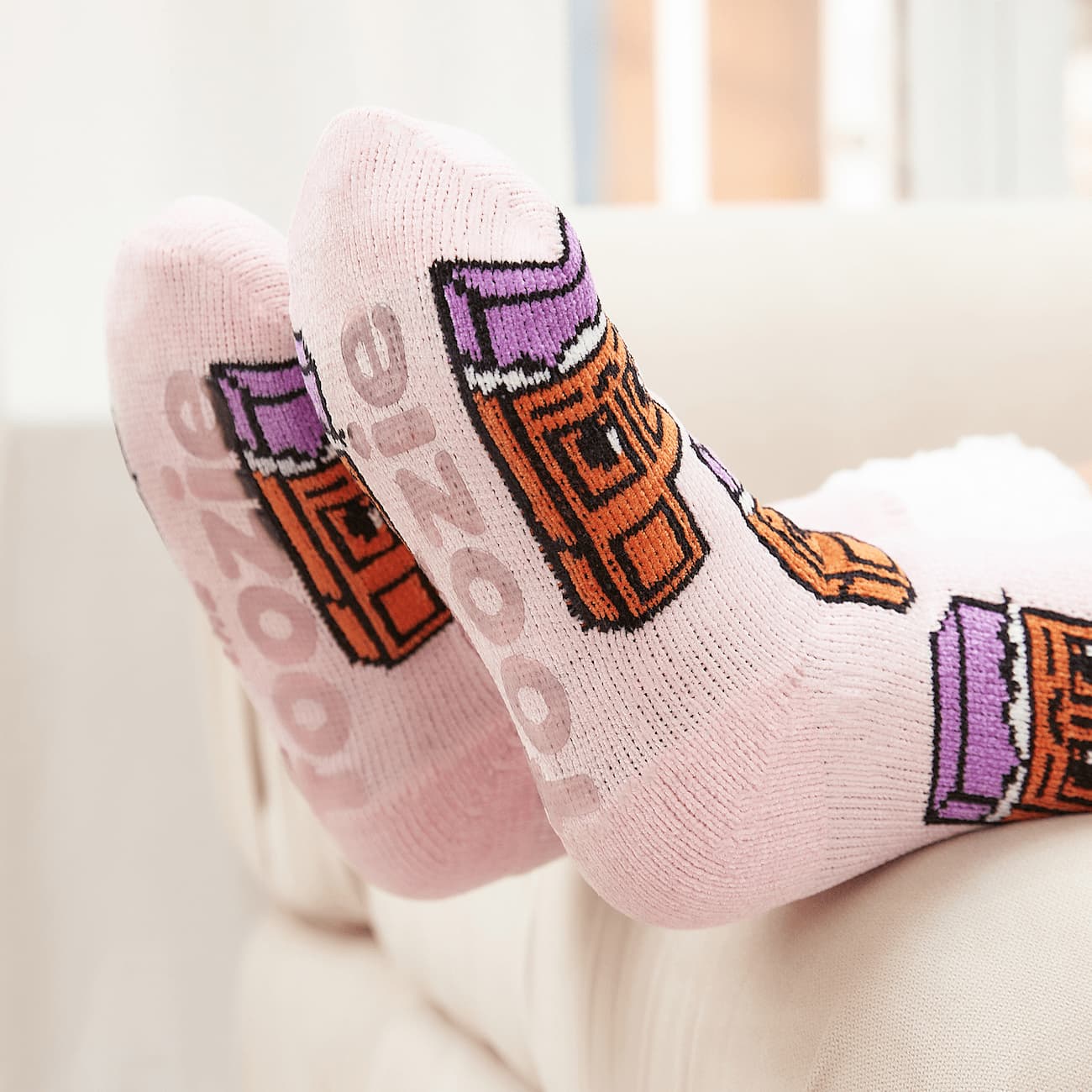 The Foozie™ Chocolate slipper socks, close-up of the soles showing the foozie grips