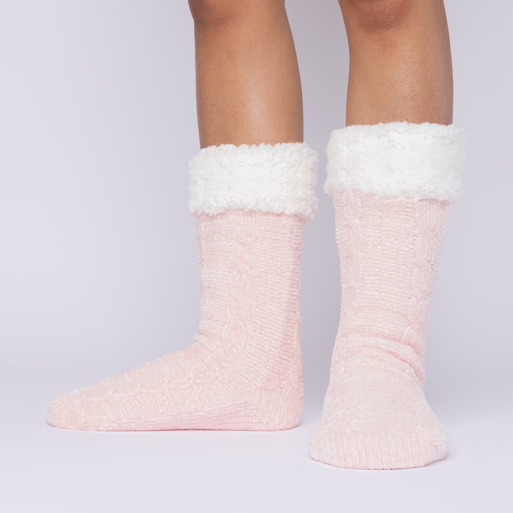 The Foozie™ in Pink, front view of both feet worn in Medium with the sherpa cuffs folded down