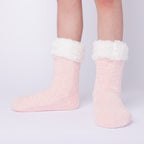 The Foozie™ in Pink, front view of both feet worn in Kids/Small with the sherpa cuffs folded down