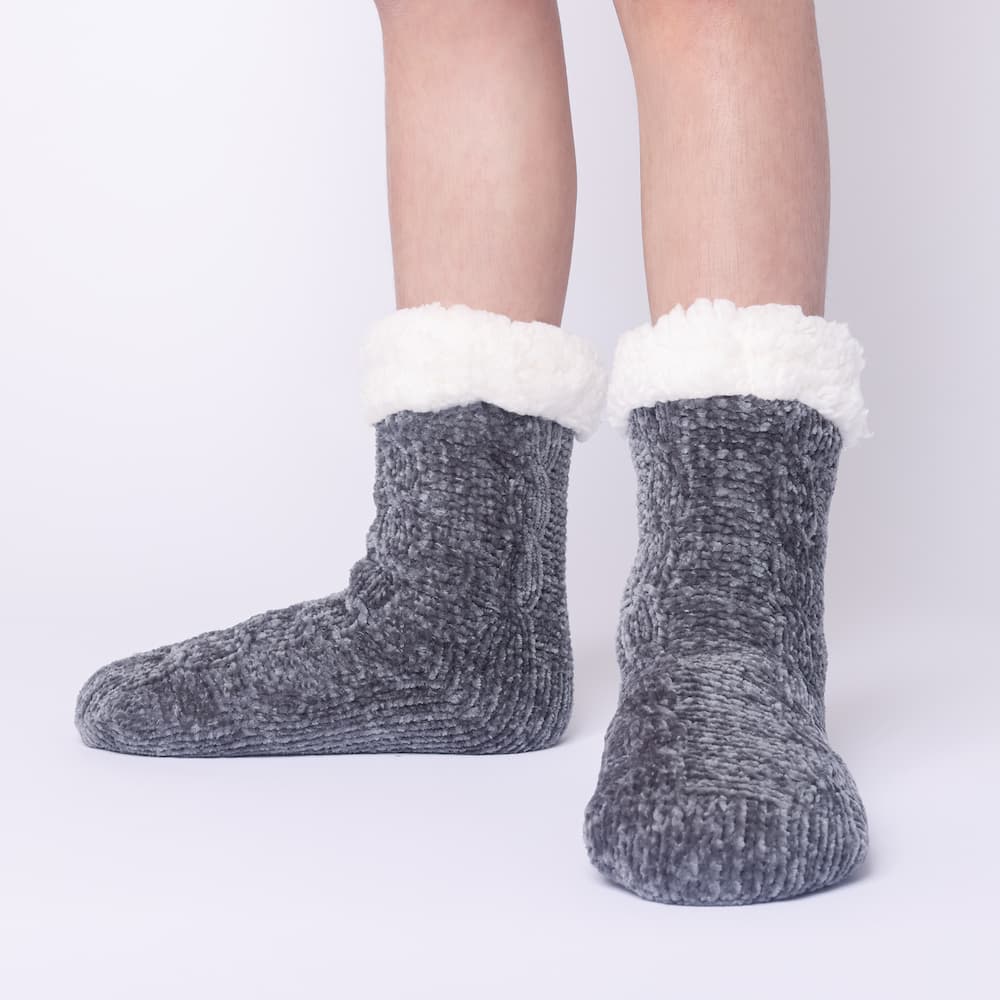 The Foozie™ in Dark Gray, front view of both feet worn in Kids/Small with the sherpa cuffs folded down